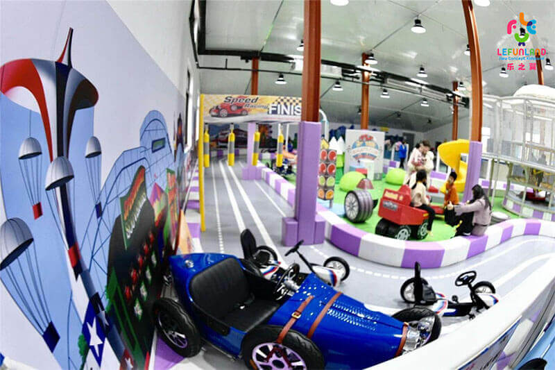 Indoor playground equipment installation showing steel frame structure and platform assembly